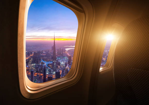 View of the Burj Khalifa from an airplane window, illustrating a journey to the UAE and its entry requirements.